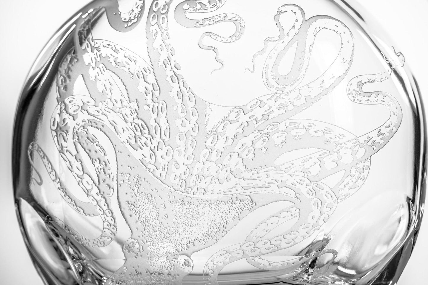 a glass bowl with an octopus design on it