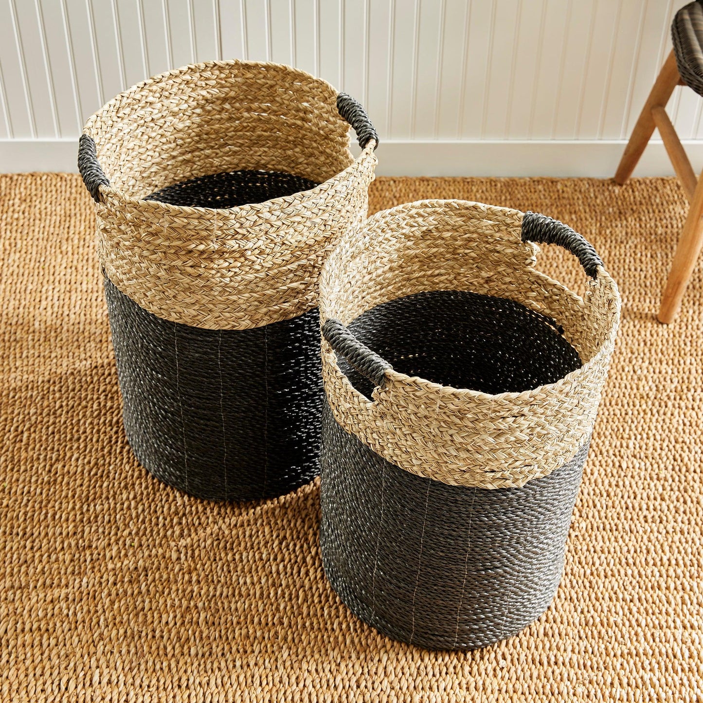 a couple of baskets sitting on top of a rug