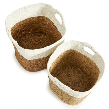 a pair of baskets sitting on top of a white table
