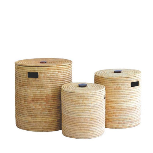 three round baskets are stacked on top of each other
