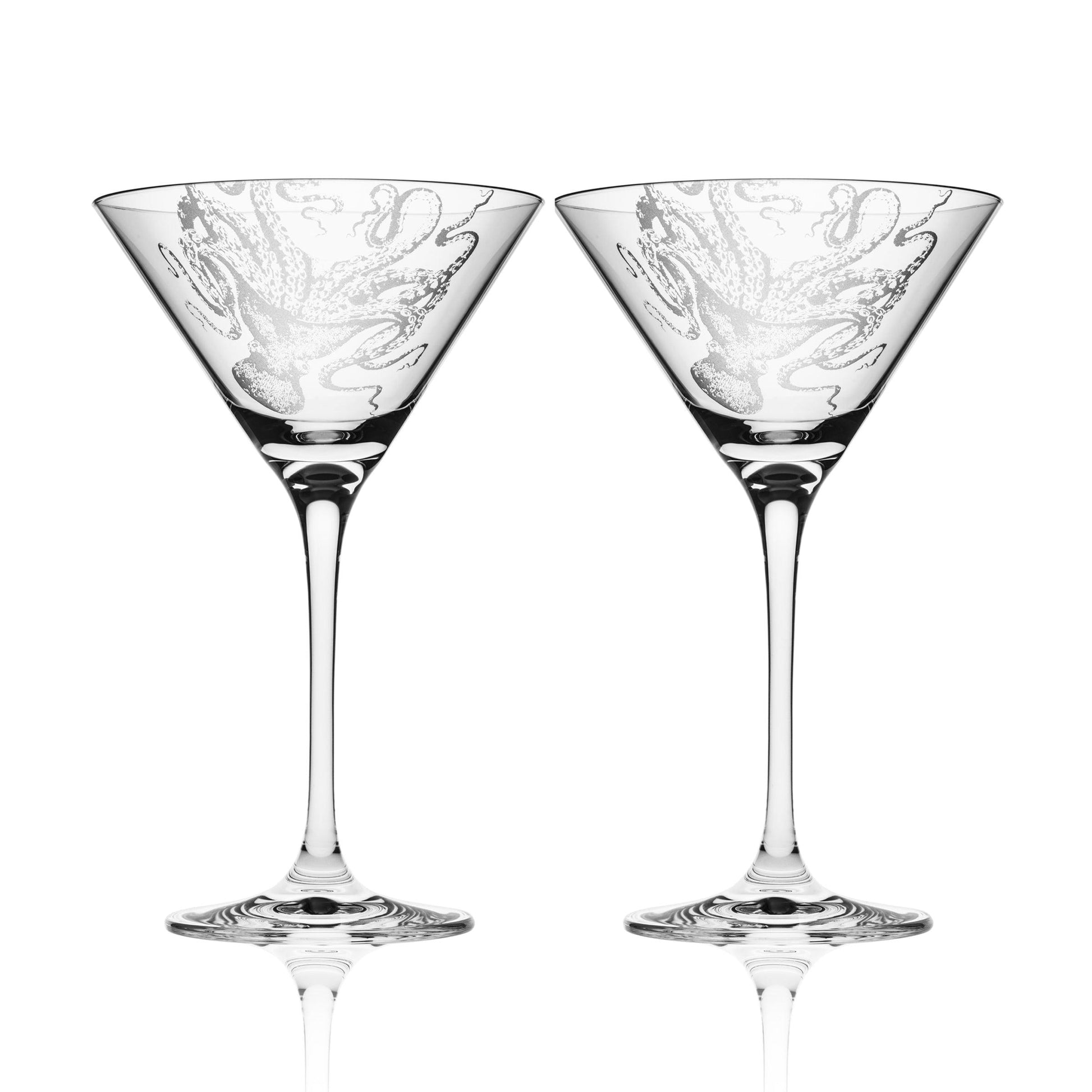 a pair of martini glasses sitting next to each other