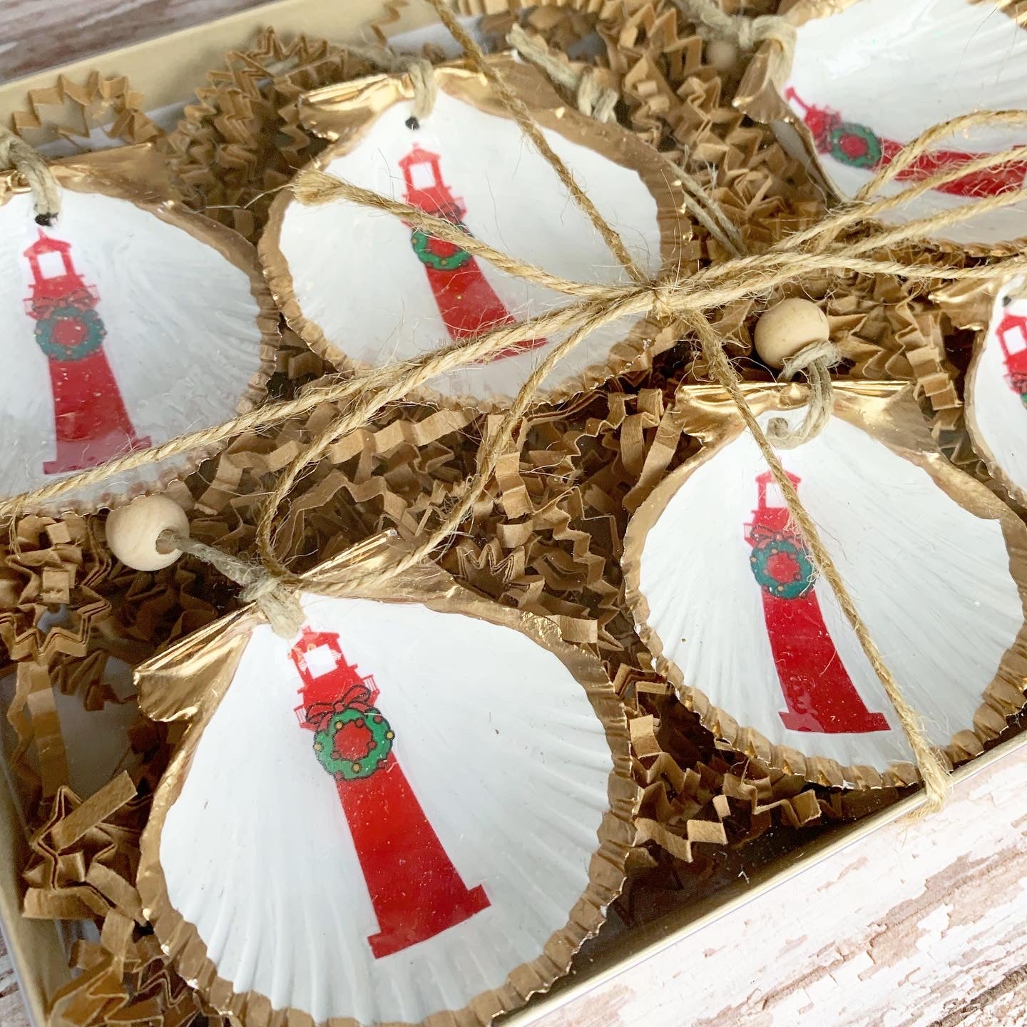 close up of mini christmas lightjouse shell ornaments