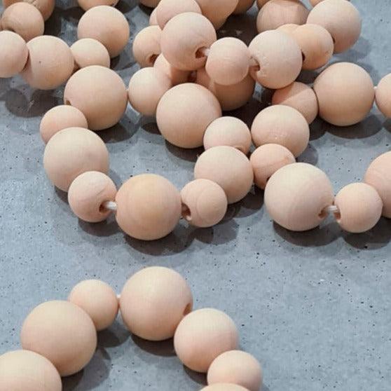 a group of wooden beads laying on top of a table