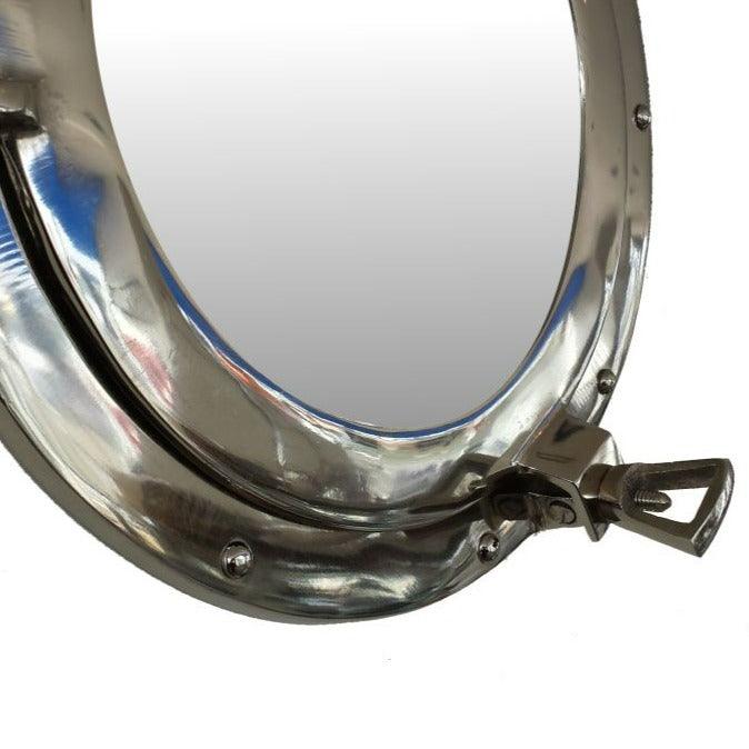 a close up of a mirror on a white background