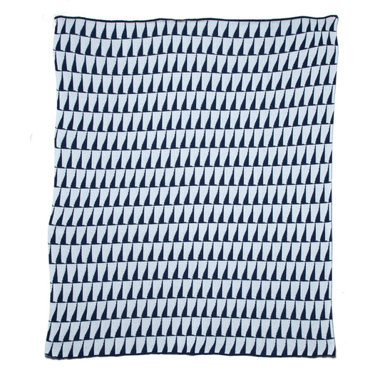 a navy and white throw blanket with triangles on it