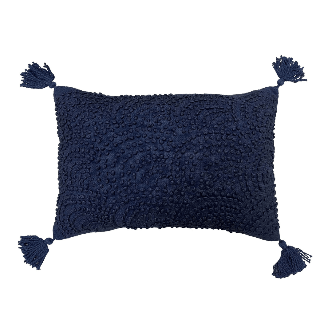 navy blue pillow with tassels