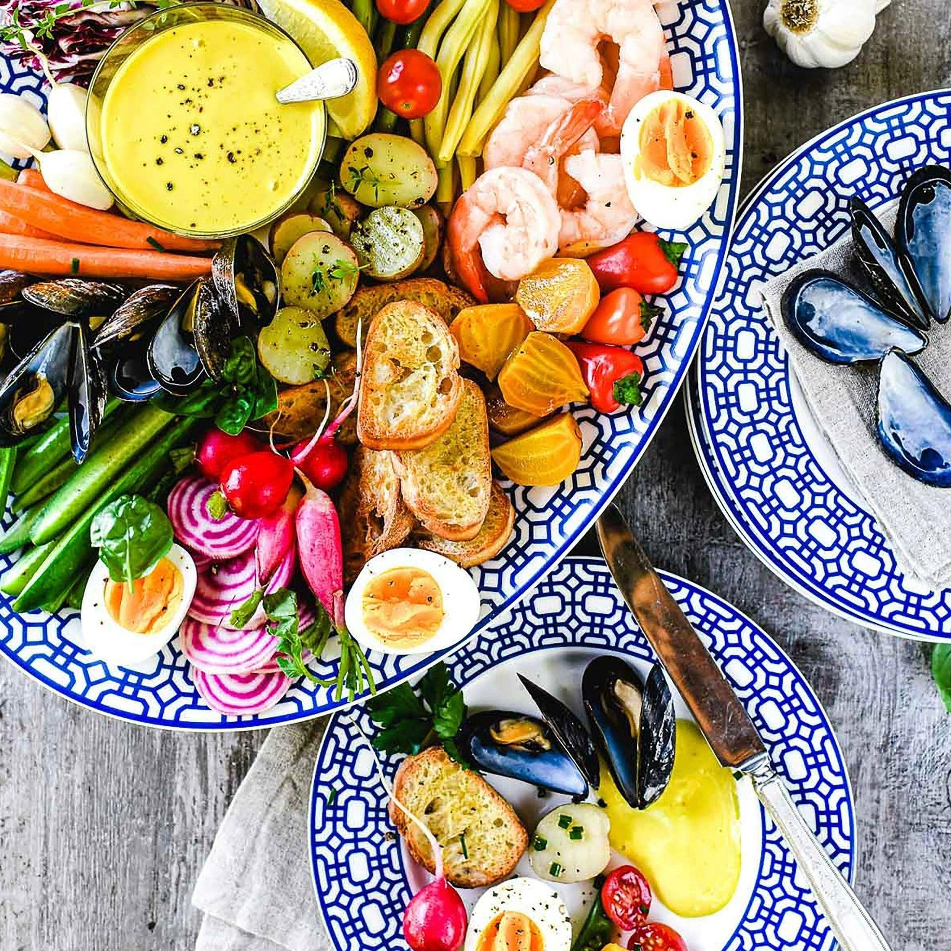 a table topped with plates filled with different types of food