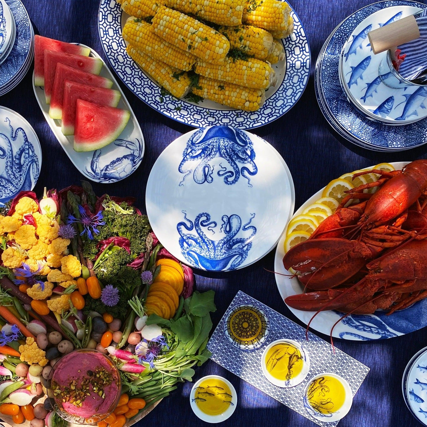 a table topped with plates and bowls filled with food