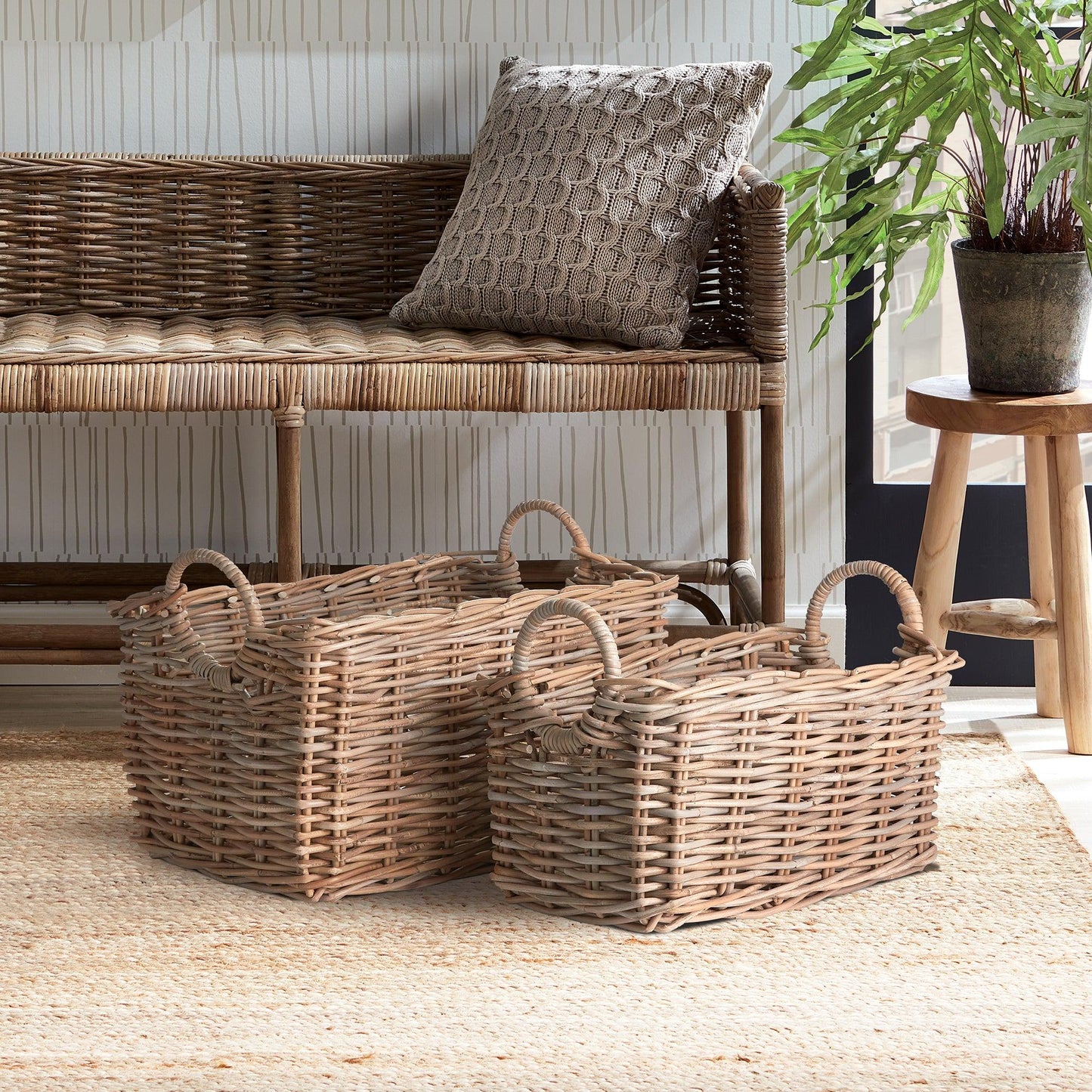 three wicker baskets sitting on a rug next to a bench