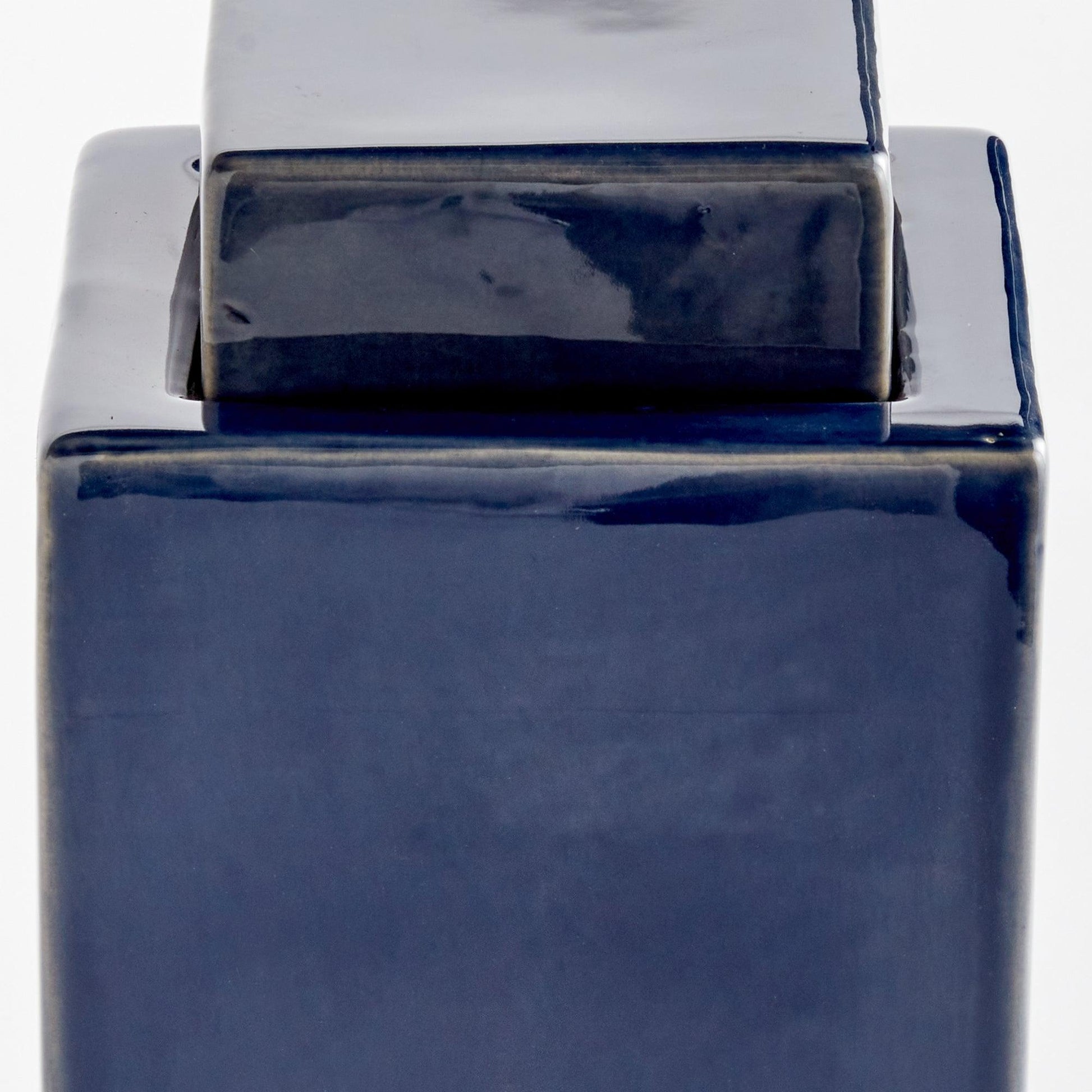 Close up of navy blue jar 