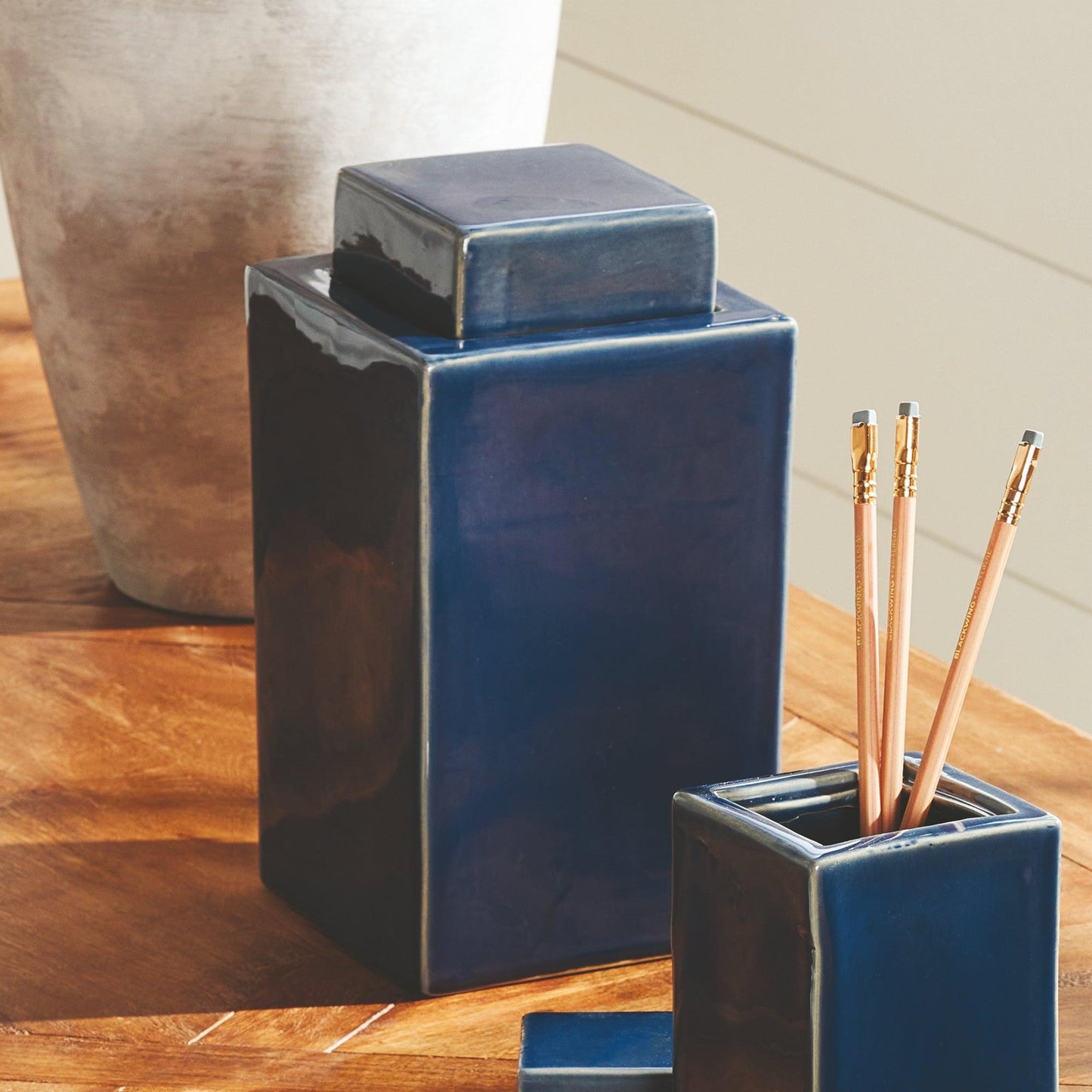 Dark blue jars on a table 