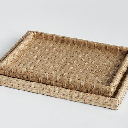 two woven ottoman trays stacked