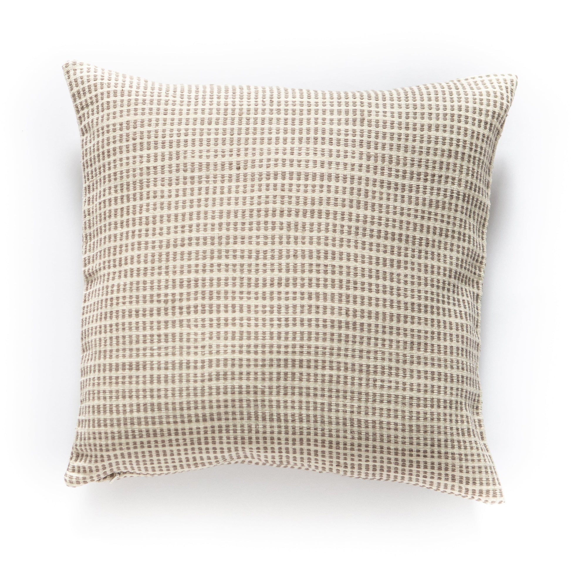 a beige and white pillow on a white background