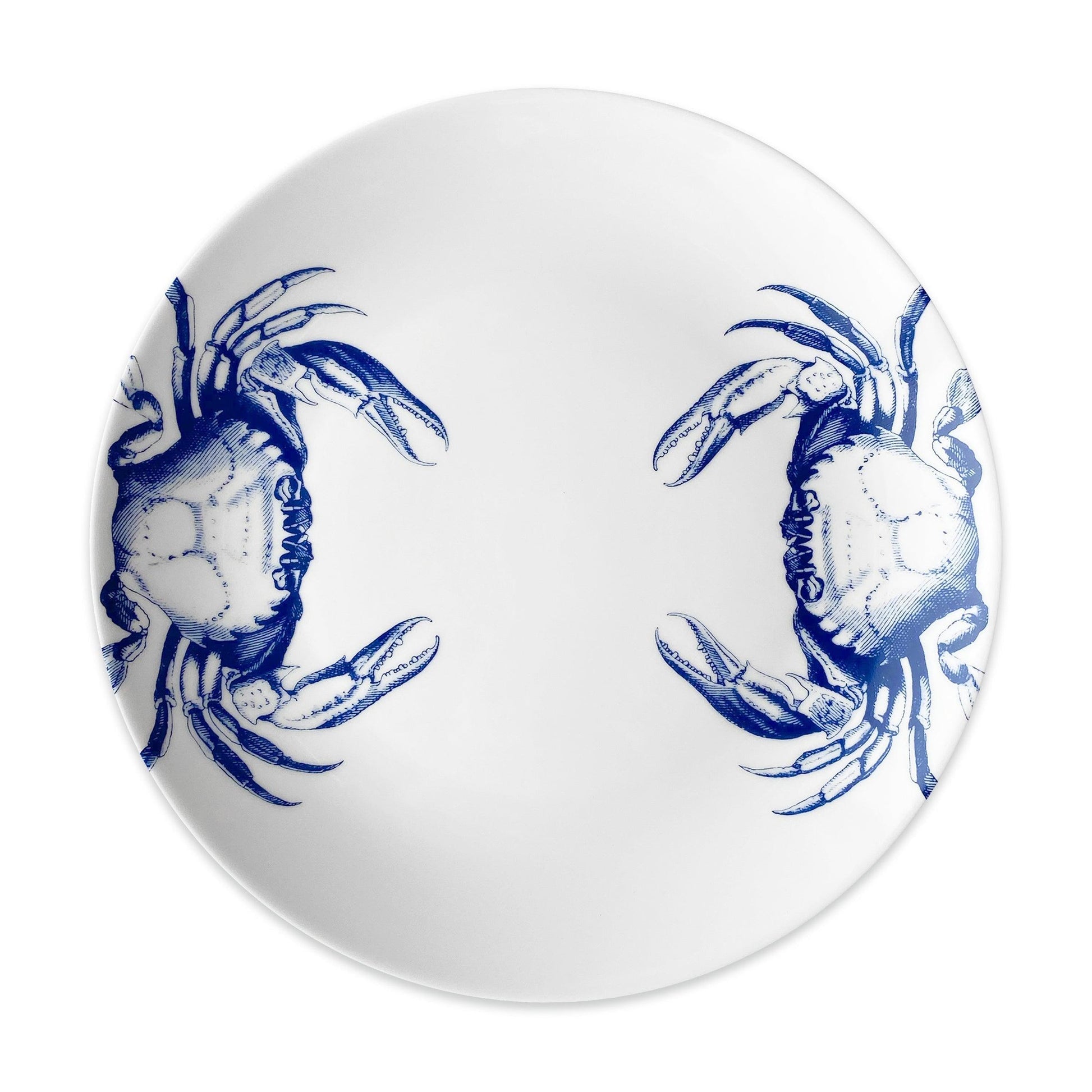 a blue and white plate with two crabs on it