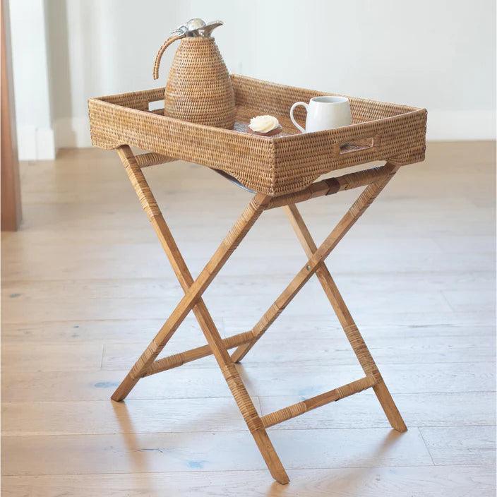 a tray with a tea pot and a cup on it