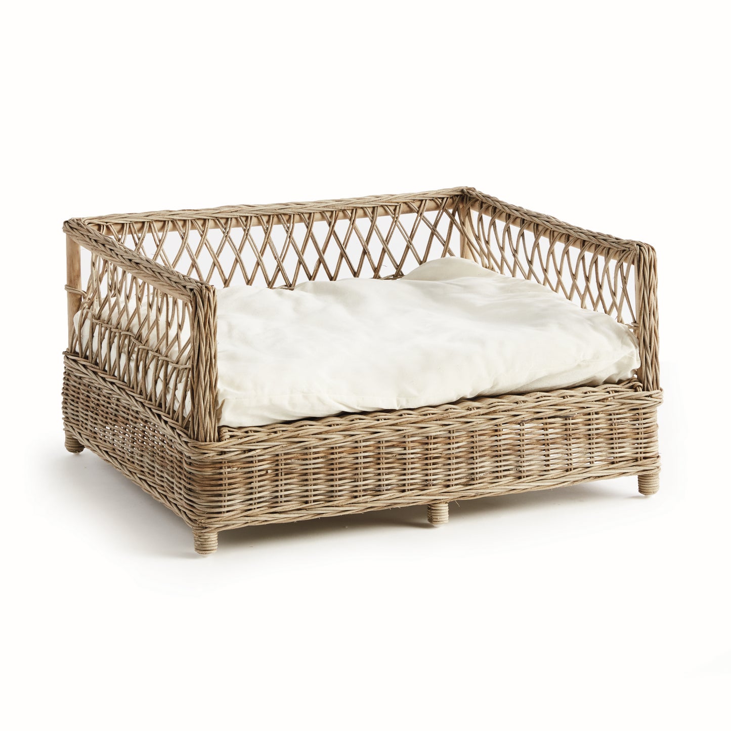 rattan dog bed with white cushion