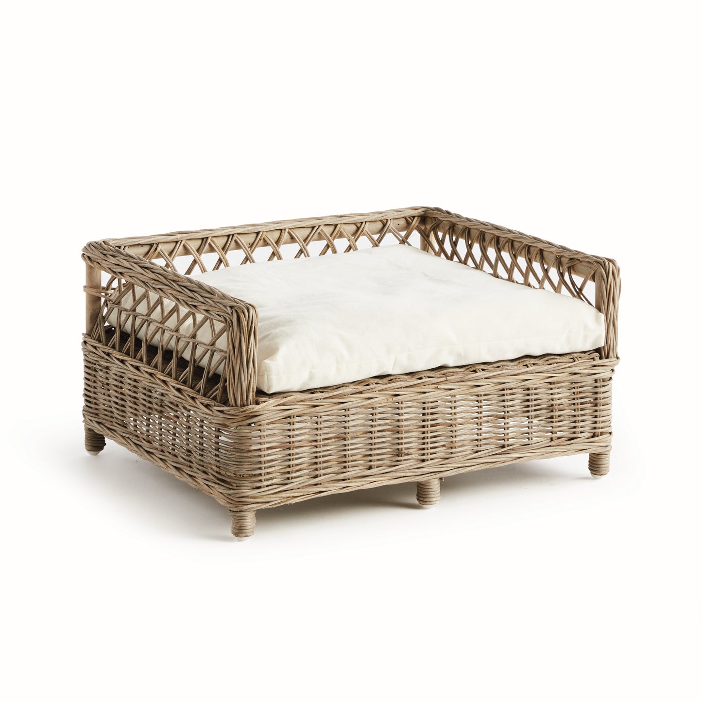 rattan dog bed with white cushion