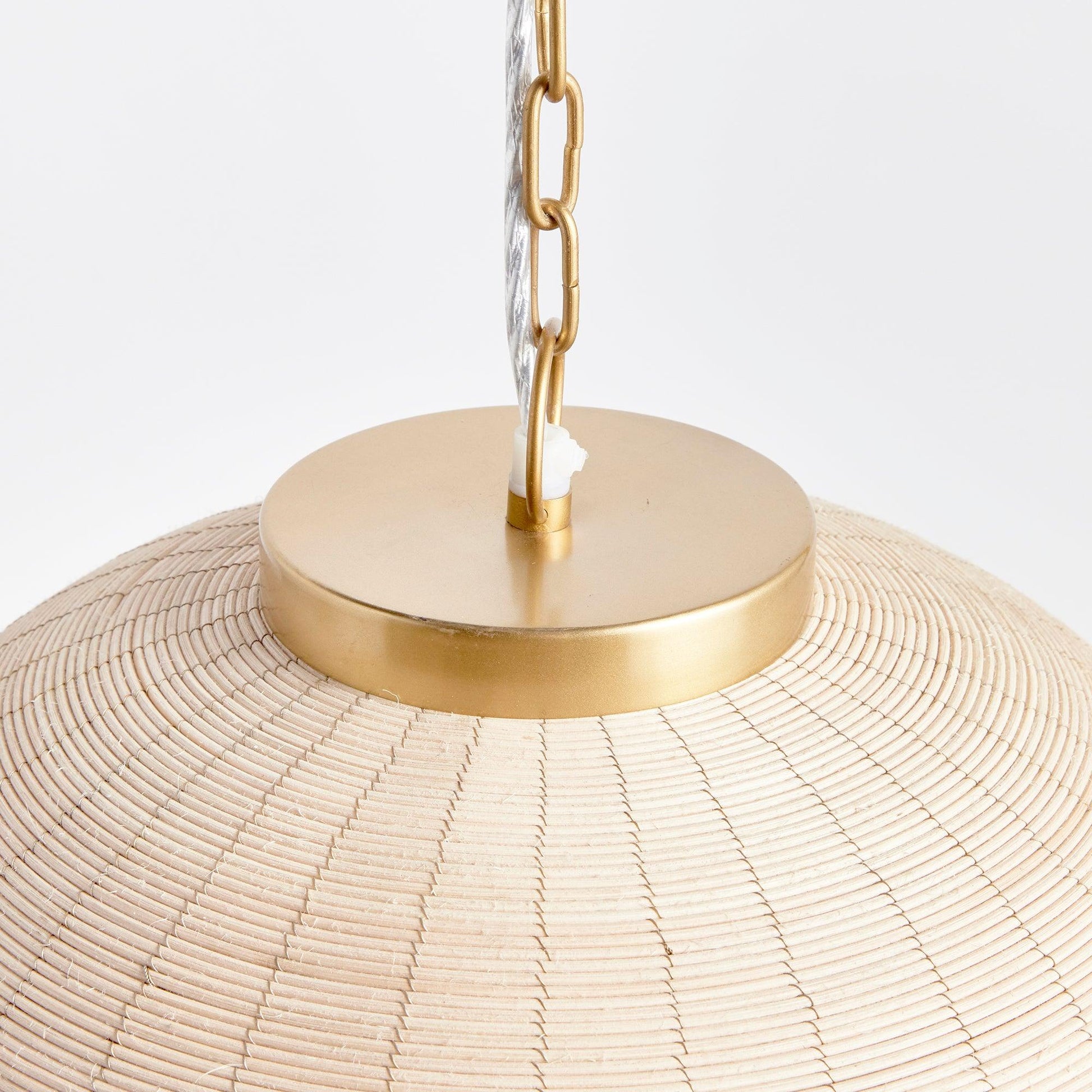 a lamp shade with a chain hanging from it