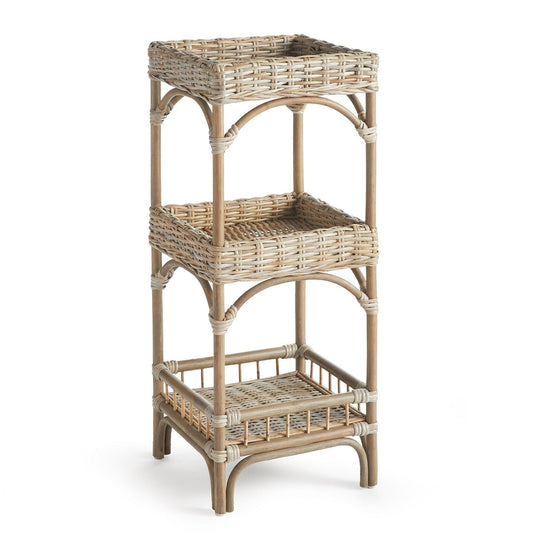 a wicker shelf with three baskets on top of it