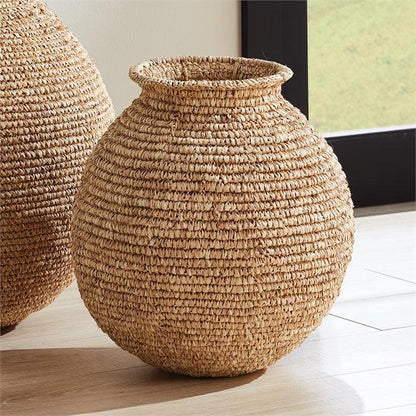 two large woven vases sitting on top of a wooden floor