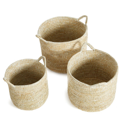 three woven baskets sitting next to each other