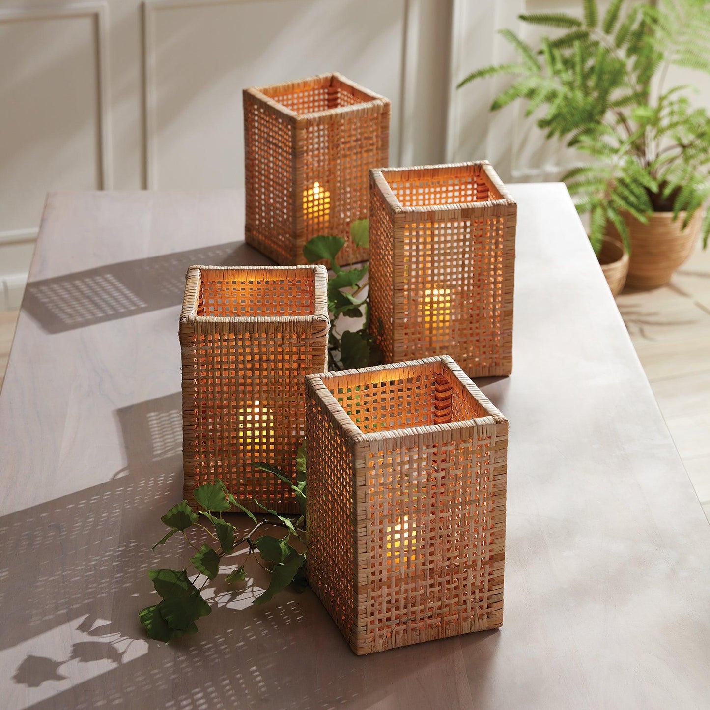 a group of four wicker baskets sitting on top of a table