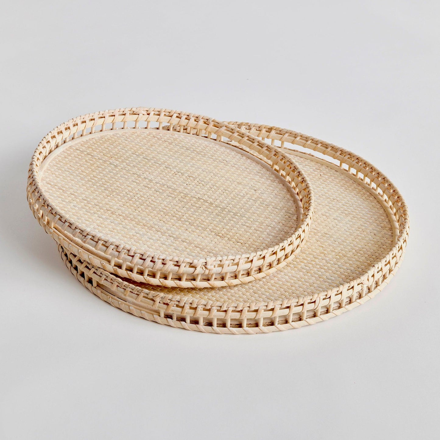 two round rattan trays stacked