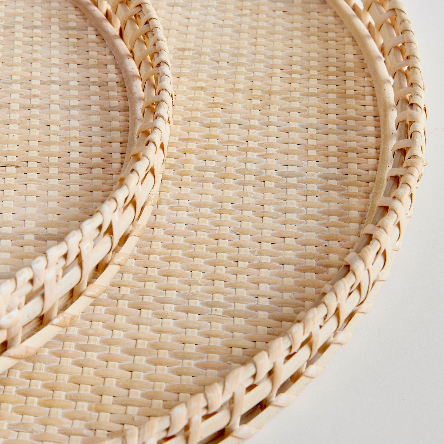 close up of two rattan trays