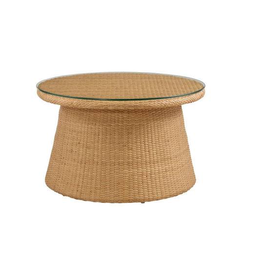 a round wicker table with a glass top