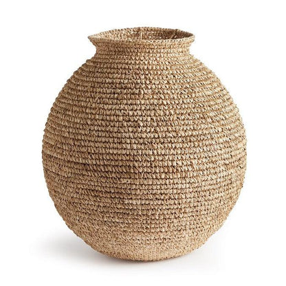 a large woven vase on a white background