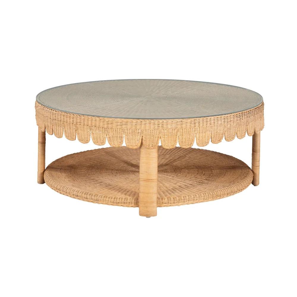 a scalloped round coffee table with a glass top