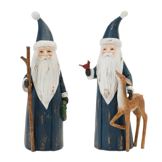 two wooden blue santa claus figures