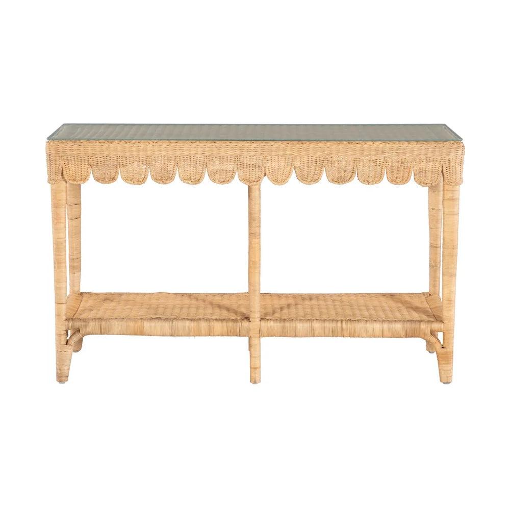 a rattan scalloped table with a glass top on a white background