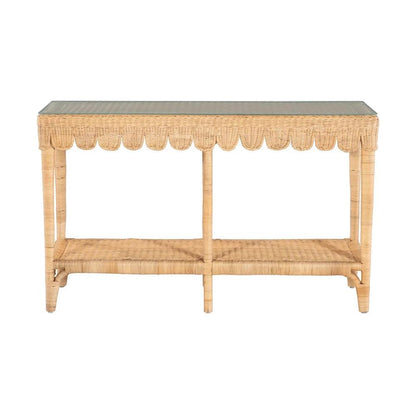 a rattan scalloped table with a glass top on a white background