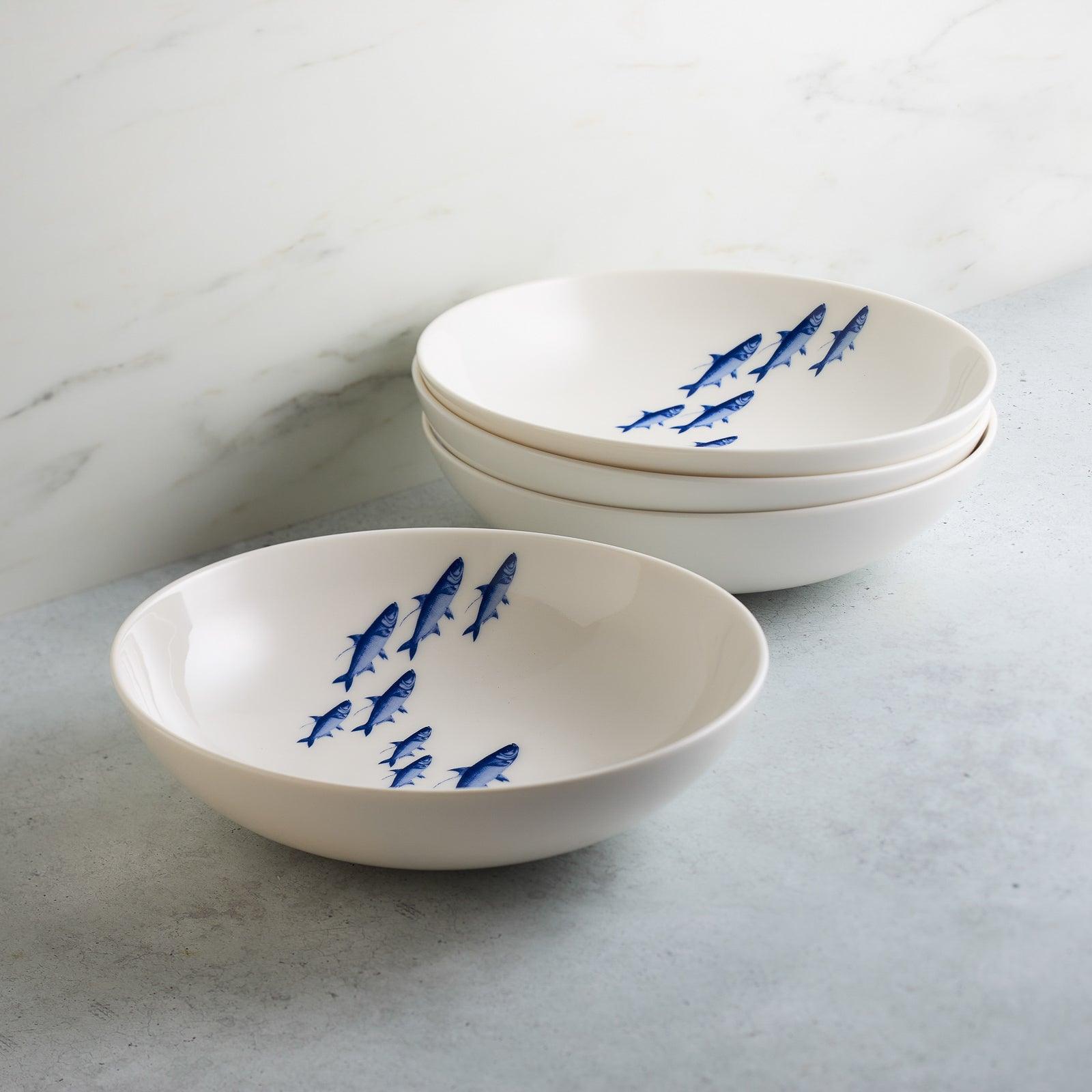 a couple of white bowls sitting on top of a counter