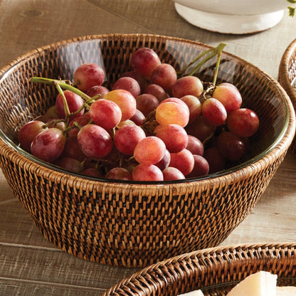 rattan serving bowl filled with red grapes