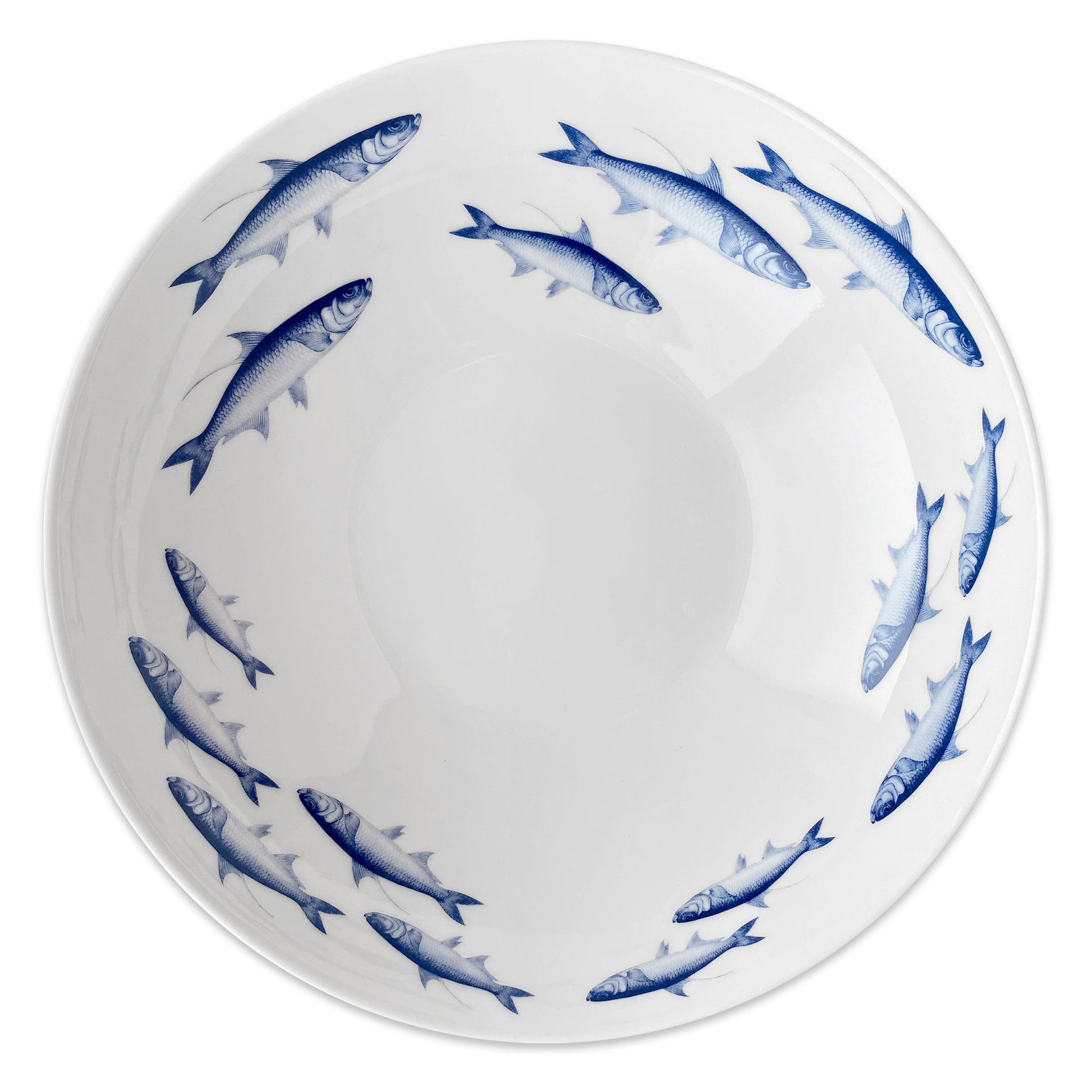 a blue and white bowl with fish on it