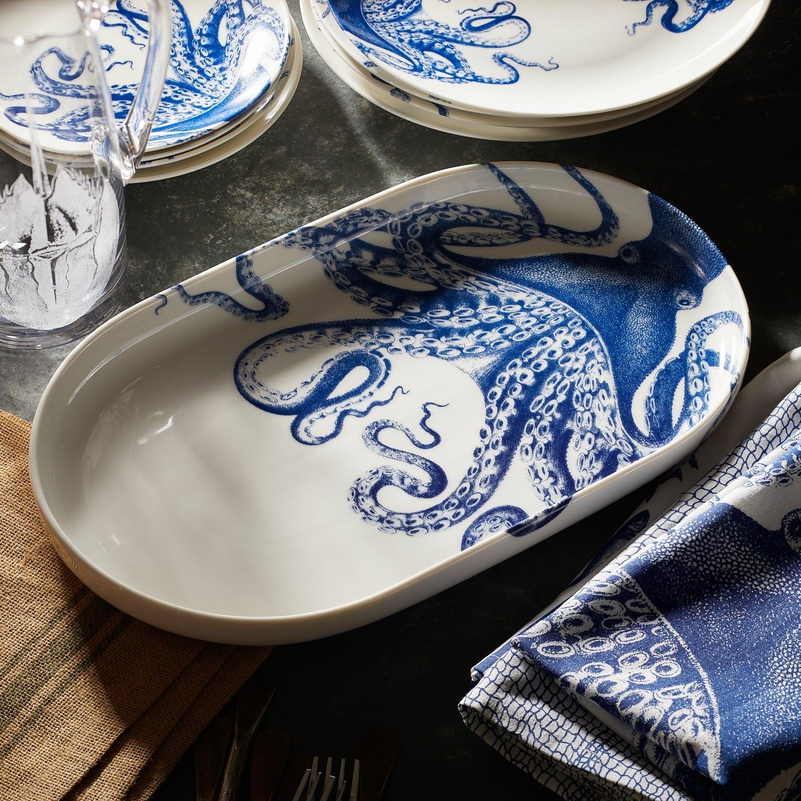 a blue and white plate with an octopus on it