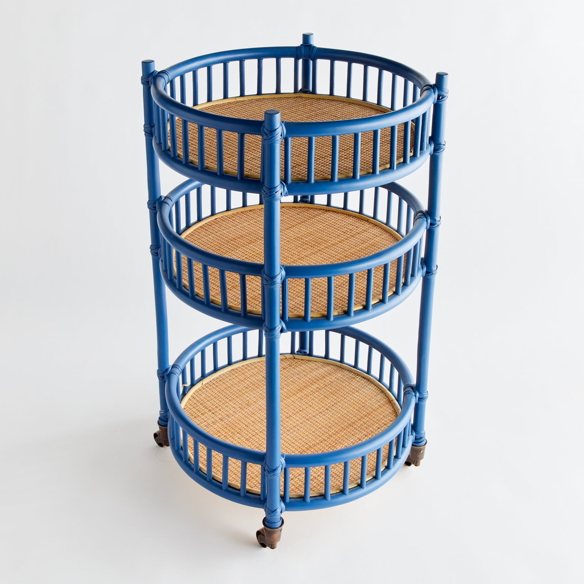 blue and tan rattan bar cart on wheels