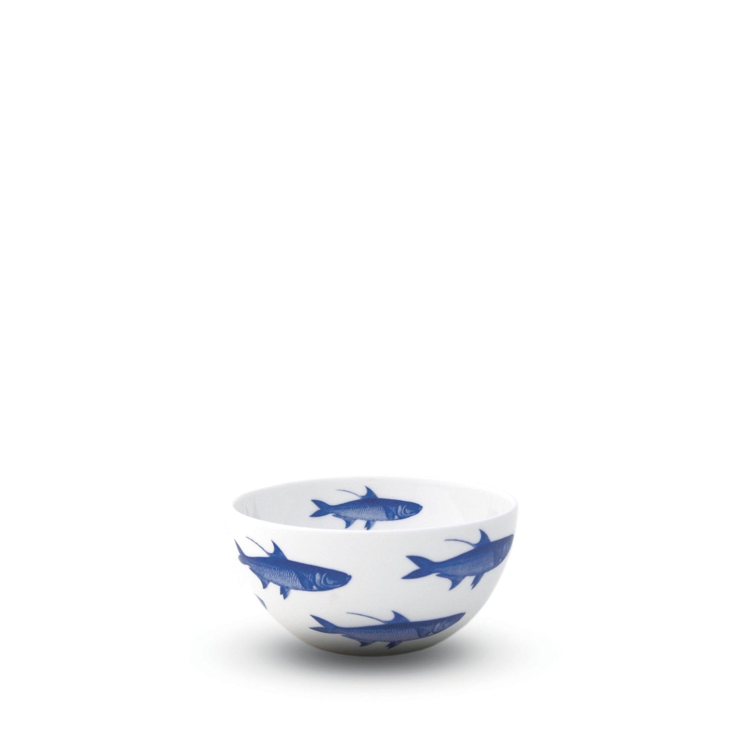 a blue and white bowl with fish on it