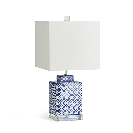 square lamp with white shade and blue and white geometric pattern