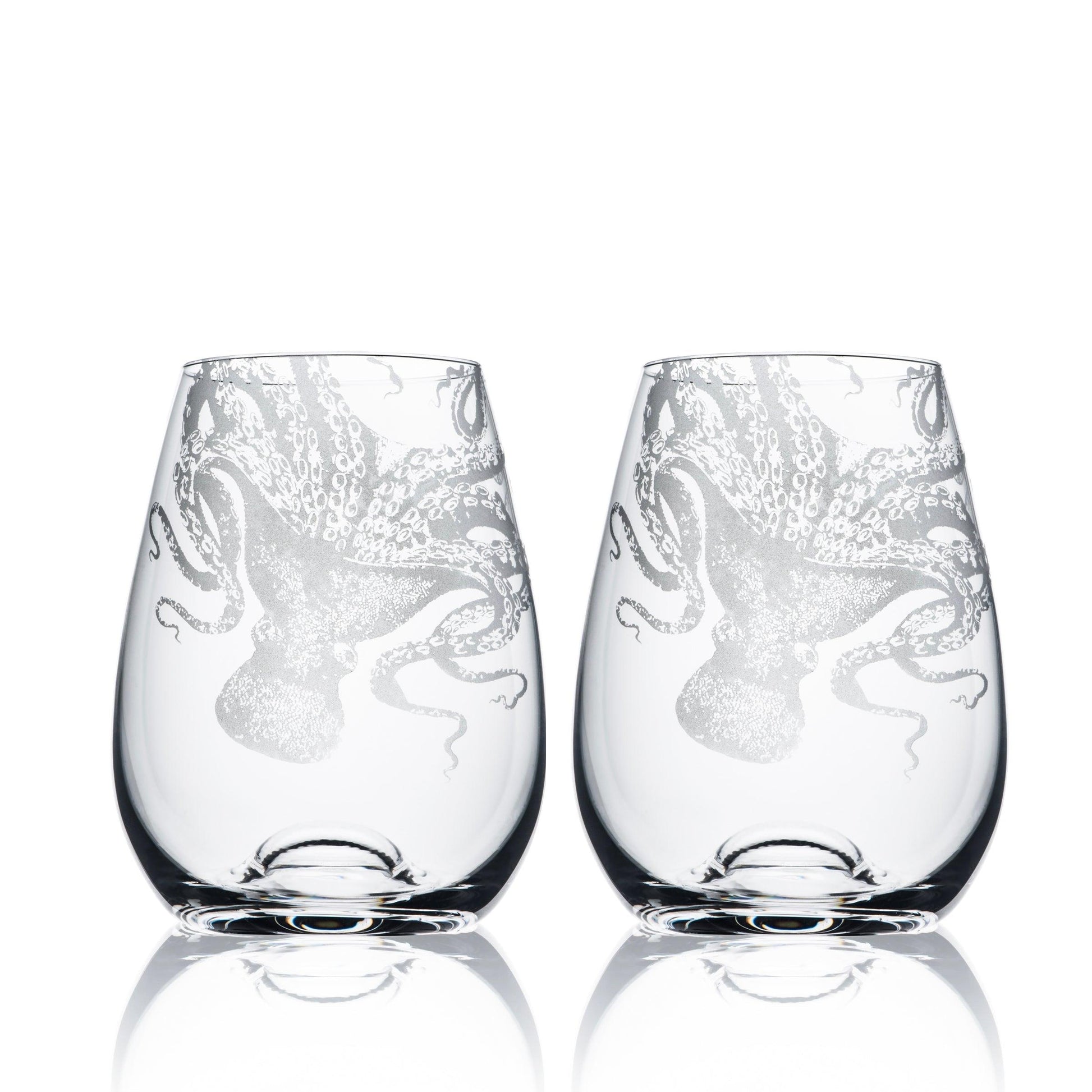 a couple of stemless wine glasses sitting next to each other