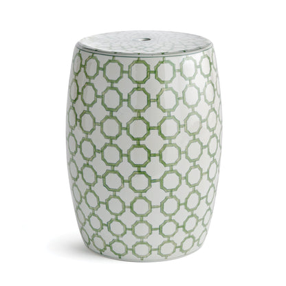 a white and green stool with a pattern on it