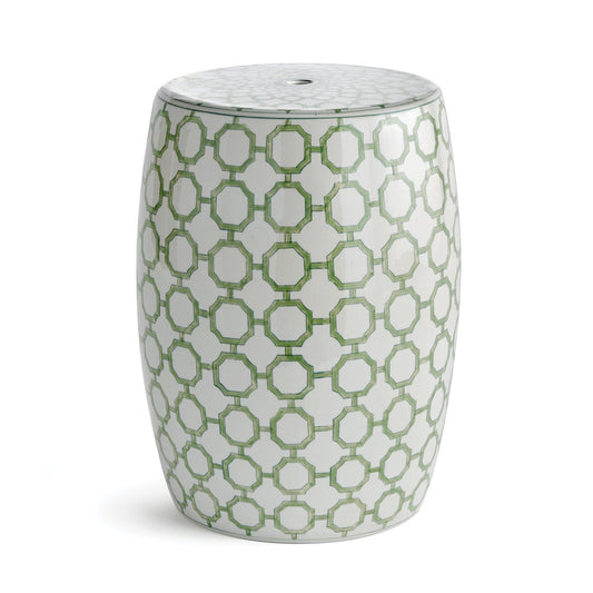 a white and green stool with a pattern on it