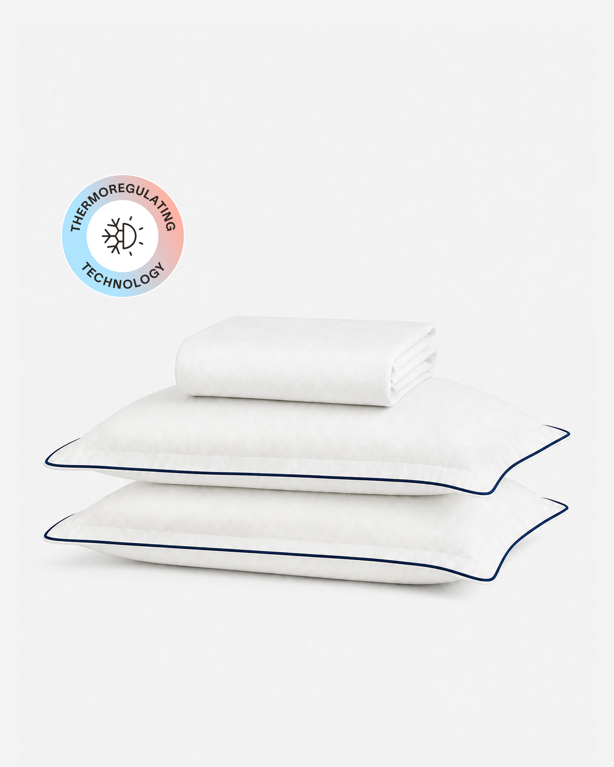 Porto cooling fitted sheet set with a folded white sheet, two blue-trimmed pillowcases, and a temperature-regulating badge