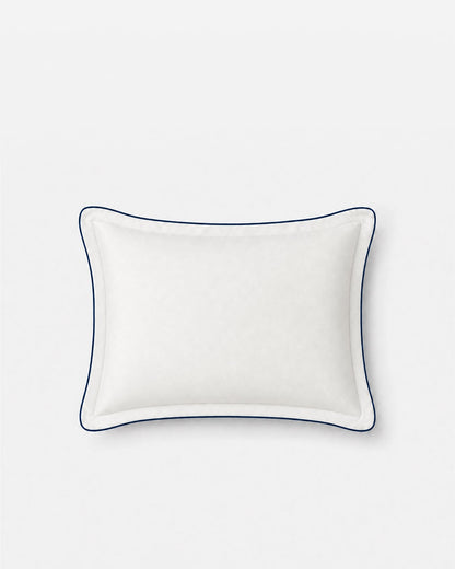 Front view of a Porto white bamboo viscose cooling pillowcase with midnight blue piping