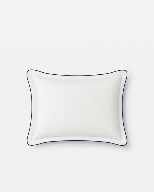 Front view of a Porto white bamboo viscose cooling pillowcase with midnight blue piping