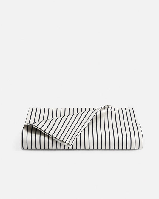 Folded Porto bamboo viscose cooling top sheet in white with midnight blue stripes