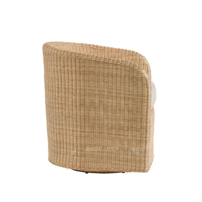 the back of a wicker chair against a white background