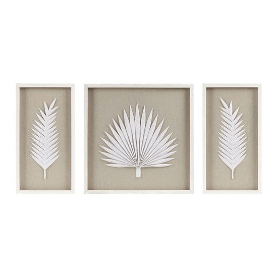 three white paper cut art pieces of palm leaves